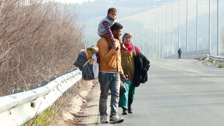 Migrant family walking the street
